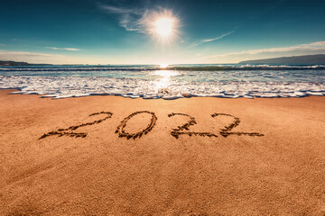 Happy New Year 2022 concept on the sea beach; sunrsie shot