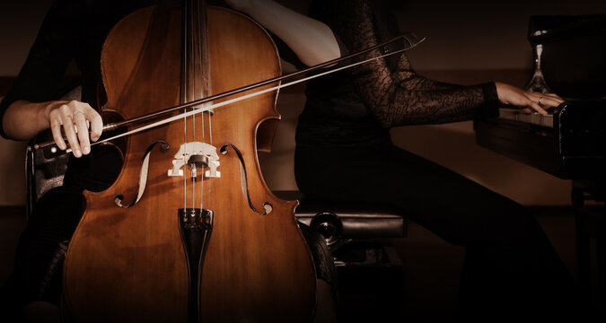 Cello and piano players. Duet of cellist and pianist
