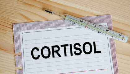 on the sheet from the diary printed the text CORTISOL, next to the thermometer.