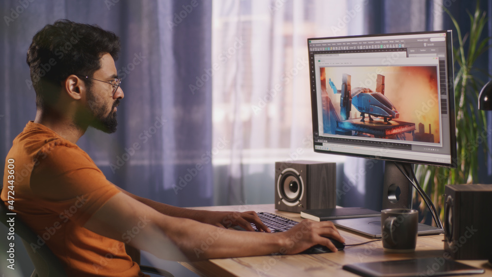 Poster side view of bearded indian guy using computer to create 3d model of futuristic aircraft while worki
