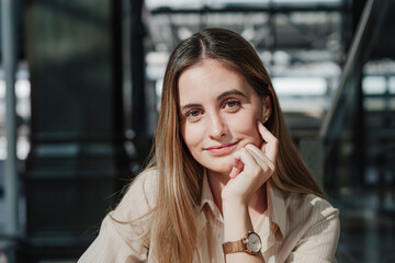 Smiling beautiful woman sitting in cafe