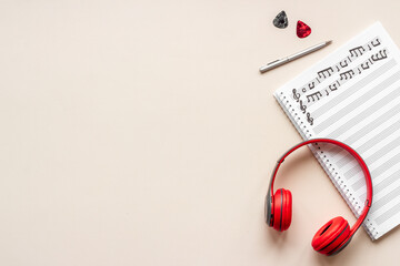 Sheets with music notes and headphones. Compose music concept