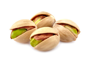 Pistachio nuts in closeup isolated on white background.