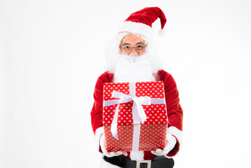 Christmas gift and happy New Year- Santa claus giving gift box. Santa claus with giftbox of presents on white background.