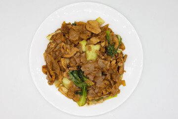 Thai Pad See Ew with Chicken on a White Plate