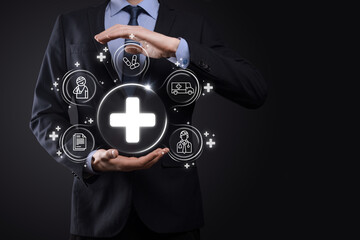 Businessman hold virtual plus medical network connection icons. Covid-19 pandemic develop people...