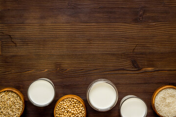 Fototapeta na wymiar Dairy free vegan milk with nuts and cereals, top view