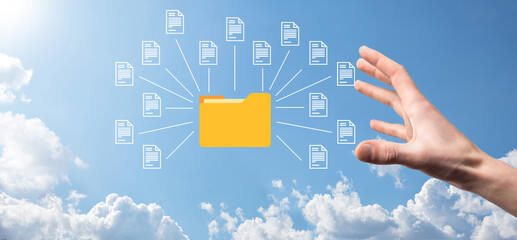 Document Management System DMS .Businessman hold folder and document icon.Software for archiving, searching and managing corporate files and information.Internet Technology Concept.Digital security.
