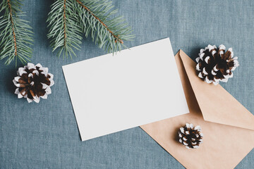 Christmas or New Yera greeting card mockup with fir tree branches and cones