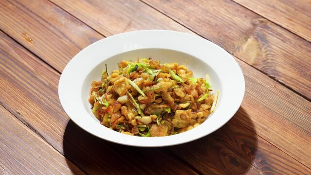 Chinese style home-cooked stir-fry with garlic sprouts and scrambled eggs