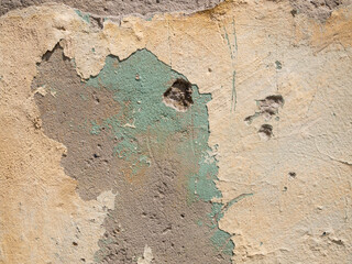 Severely damaged concrete wall. Part of a destroyed building. - obrazy, fototapety, plakaty
