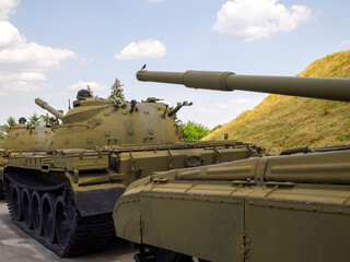 Several Soviet tanks. The bird sits on the muzzle of the tank.