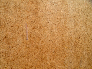 Thick brown cardboard with a rough texture.