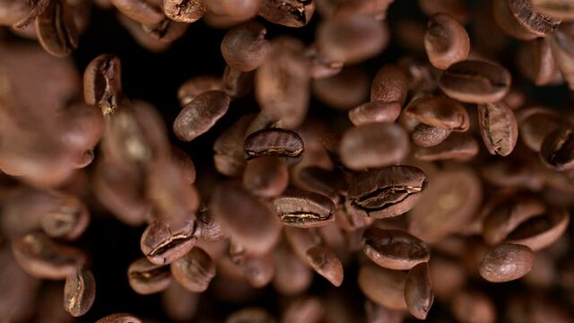 Coffee beans explosion. Super slow motion at 1000 fps, filmed on high speed cinematic camera.