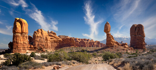 balanced rock in arches national park with clouds