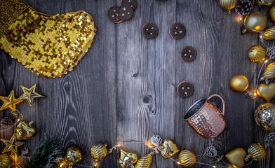 Moscow, Russia, December 2021, background with Christmas decor, cookies, Christmas decorations, New Year's boot and shiny cup on a dark wood background