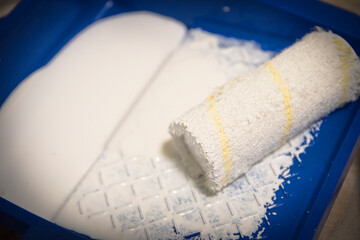 A roller that paints the wall with paint