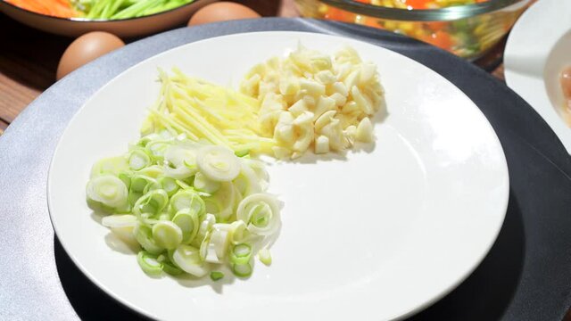 Chinese style home-cooked stir-fry with garlic sprouts and scrambled eggs