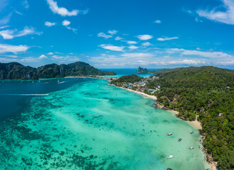 Fototapeta premium Top view of tropical island with limestone rocks and blue clear 