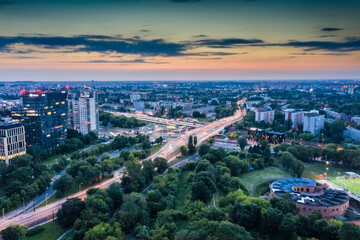 Aerial view on football stadium illuminated by jupiter on evenin