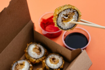 sushi rolls in a disposable container