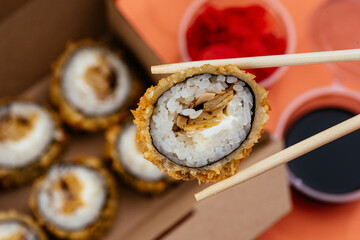 sushi rolls in a disposable container
