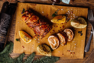 Roasted pork roll stuffed with carrot and walnuts. Menu concept.
