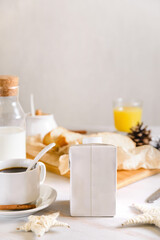 blank half liter milk box packaging  with lid on a table with breakfast. package template,  mockup of a retail container for liquid products.
