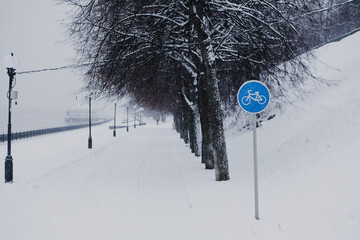 Road signs in winter by the road.