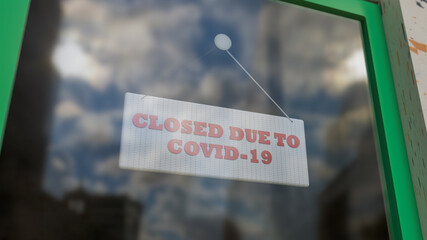 Closed Sign on Shop Window. Store sign. Close-up on a closed sign in the window of a shop displaying the message. The glass reflects the day city and the sky. 3d rendering