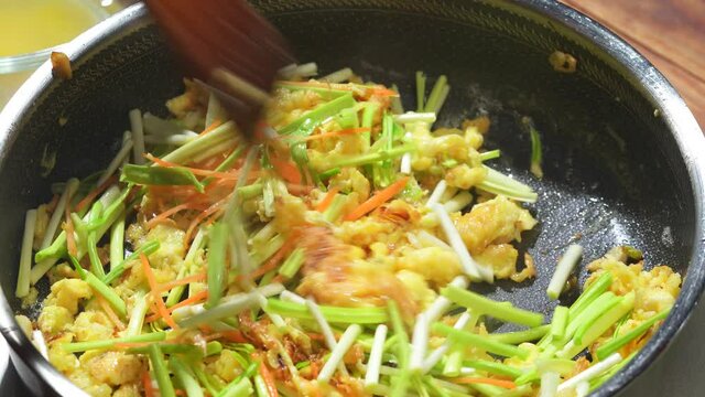 Chinese style home-cooked stir-fry with garlic sprouts and scrambled eggs