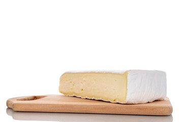 One fragrant piece of brie cheese on a wooden board, close-up, isolated on white.