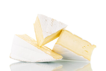 Three fragrant pieces of brie cheese, close-up, isolated on white.