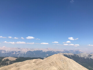 Beautiful landscape view from a high mountain to the forest and mountains in a tropical country with resorts and the sea