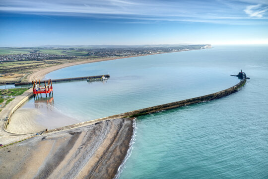 Aerial view along the entrance to Newhaven port and the beach which leads to Seaford..