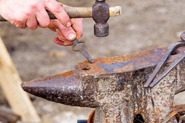 small old antique anvil for striking