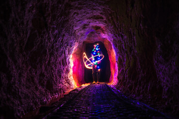 Light painting in the Historic rail tunnel, a part of an old gold mine transportation system...