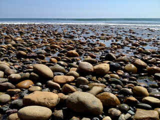 ground view seascape with closeup of beach pebbles