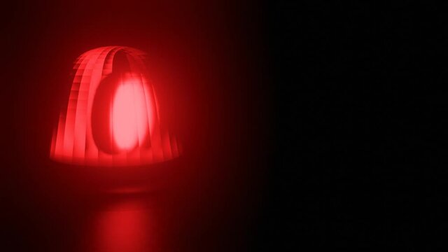 Red and blue flashing warning light on black background. Ambulance, Fire or Police Emergency rotating beacon. Seamless Looped video.