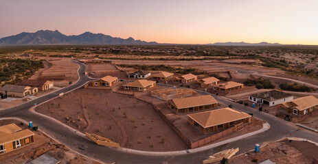 New home construction in Sahuarita Arizona, aerial at sunset, very large panorama.