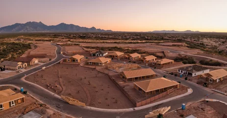 Kussenhoes New home construction in Sahuarita Arizona, aerial at sunset, very large panorama. © mdurson