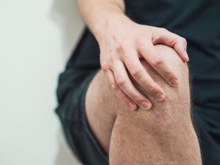 Athlete with knee pain from sports injury