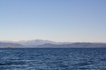 Seascape with mountains on the background