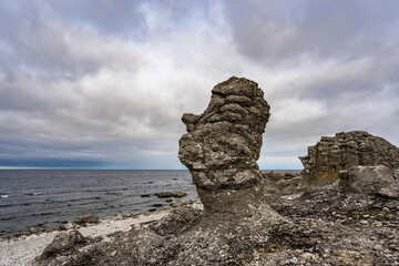 F&aring;r&ouml; Island in Sweden. Rauks, ancient stone formations. Column like landform. Rauks often occur in groups called "rauk fields". Lots of famouse limestone rauks of Gotland in the Baltic Sea.