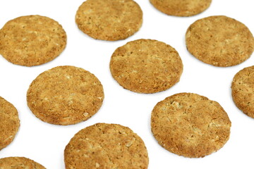Round whole wheat biscuit, cookie with raisins isolated on white background. Biscuits with whole-wheat (wholemeal) flour isolated on white background 