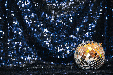 disco ball on sequin background