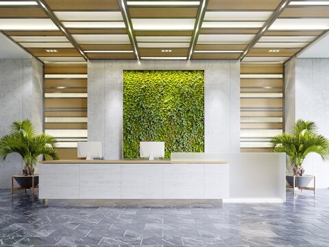 White reception desk in an office building with a green wall and illuminated wood paneling and flowerpots.