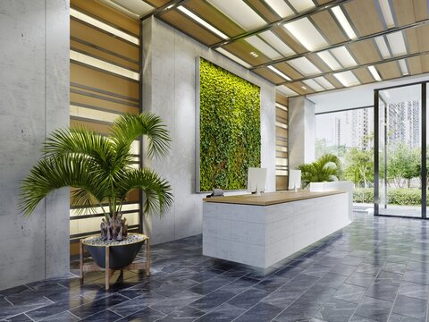 White reception desk in an office building with a green wall and illuminated wood paneling and flowerpots.