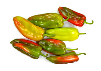 Different colored paprikas isolated on white background.