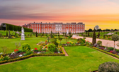 Hampton Court palace and gardens at  sunset, London, UK